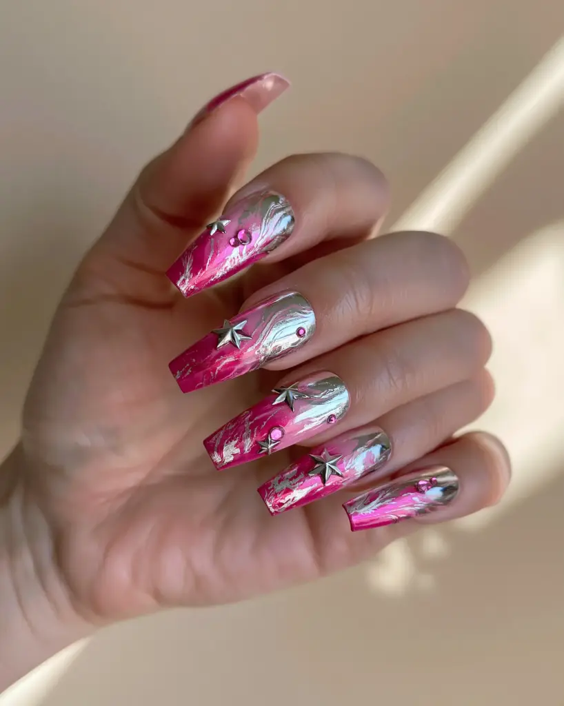 Y2K Press On Nails: The Ultimate DIY Guide to Pink Chrome Coffin Glamour 2 Hand showcasing glossy hot pink Y2K press on nails with 3D silver star charms and small pink rhinestones. (Y2K press on nails)
